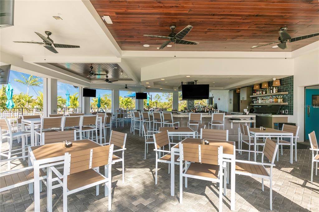 12845 Tulum Loop Venice, FL 34293 - Photo 75 of 100 a view of a dining room with furniture window and outside view