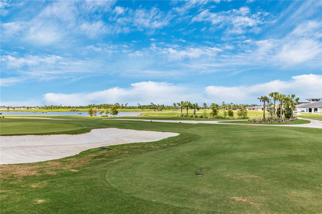 12845 Tulum Loop Venice, FL 34293 - Photo 88 of 100 a view of a golf course with an ocean