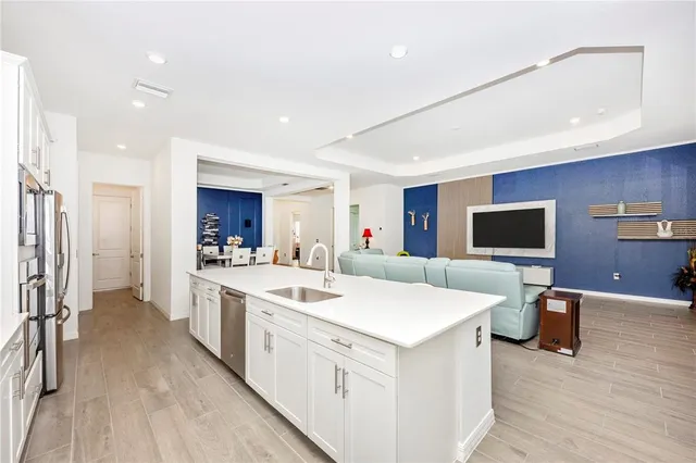 a view of a dining room with furniture and a potted plant