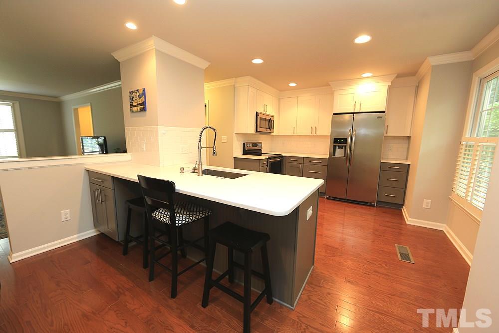 2842 Wycliff Road Raleigh, NC 27607 - Photo 10 of 30 Newly renovated with Quartz countertops, Stainless Steel appliances, and Tile backsplash!