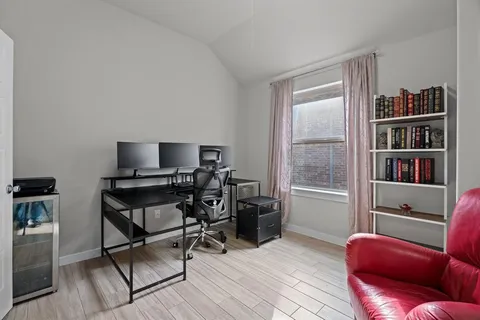 a view of a livingroom with workspace and a couch