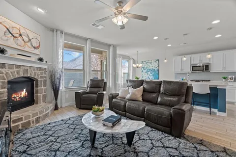 a living room with furniture and a fireplace