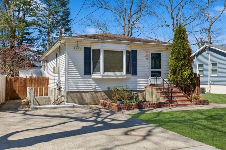 78 Kale Road Rocky Point, NY 11778 - Photo 1 of 1 a front view of a house with a yard