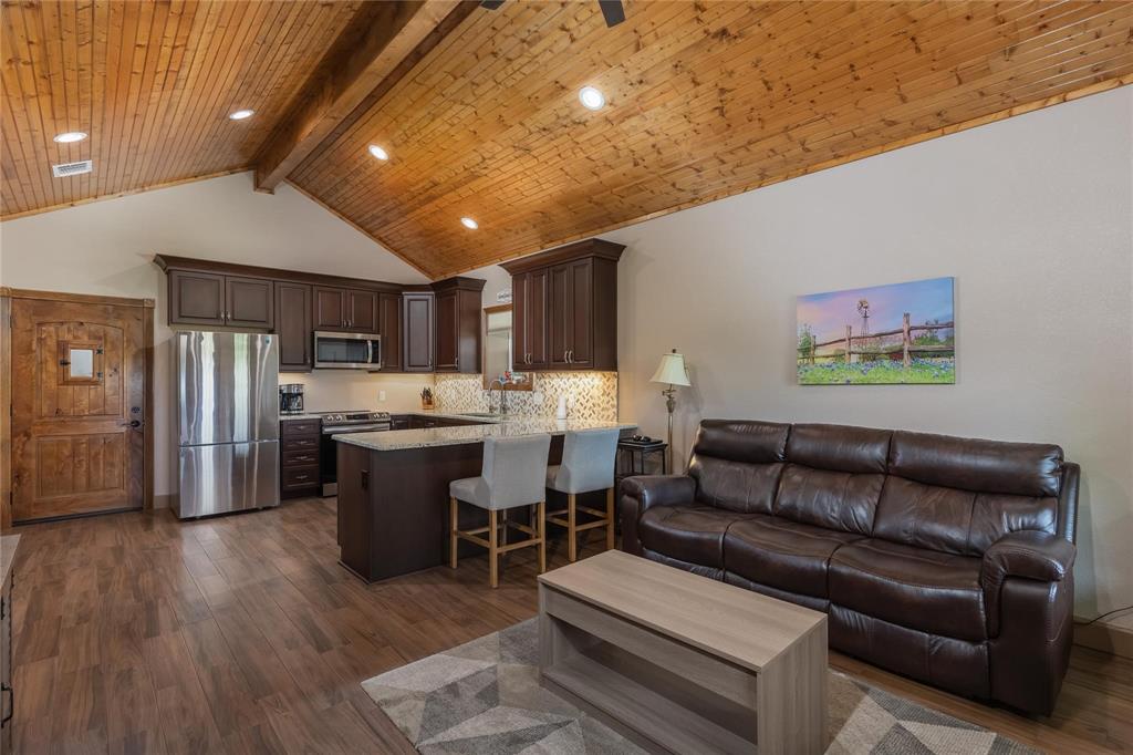 210 Spring Branch Trail North Springtown, TX 76082 - Photo 5 of 36 Vaulted wood-paneled ceiling with exposed beam and recessed lighting