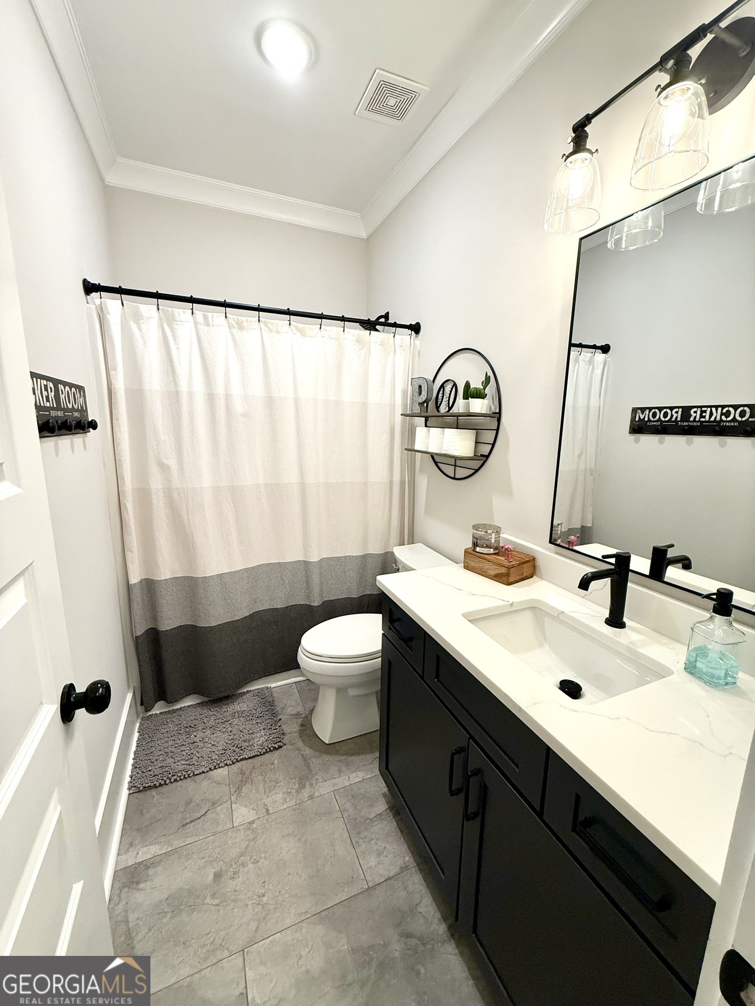120 Spring Creek Drive Rutledge, GA 30663 - Photo 26 of 38 a bathroom with a sink toilet and shower