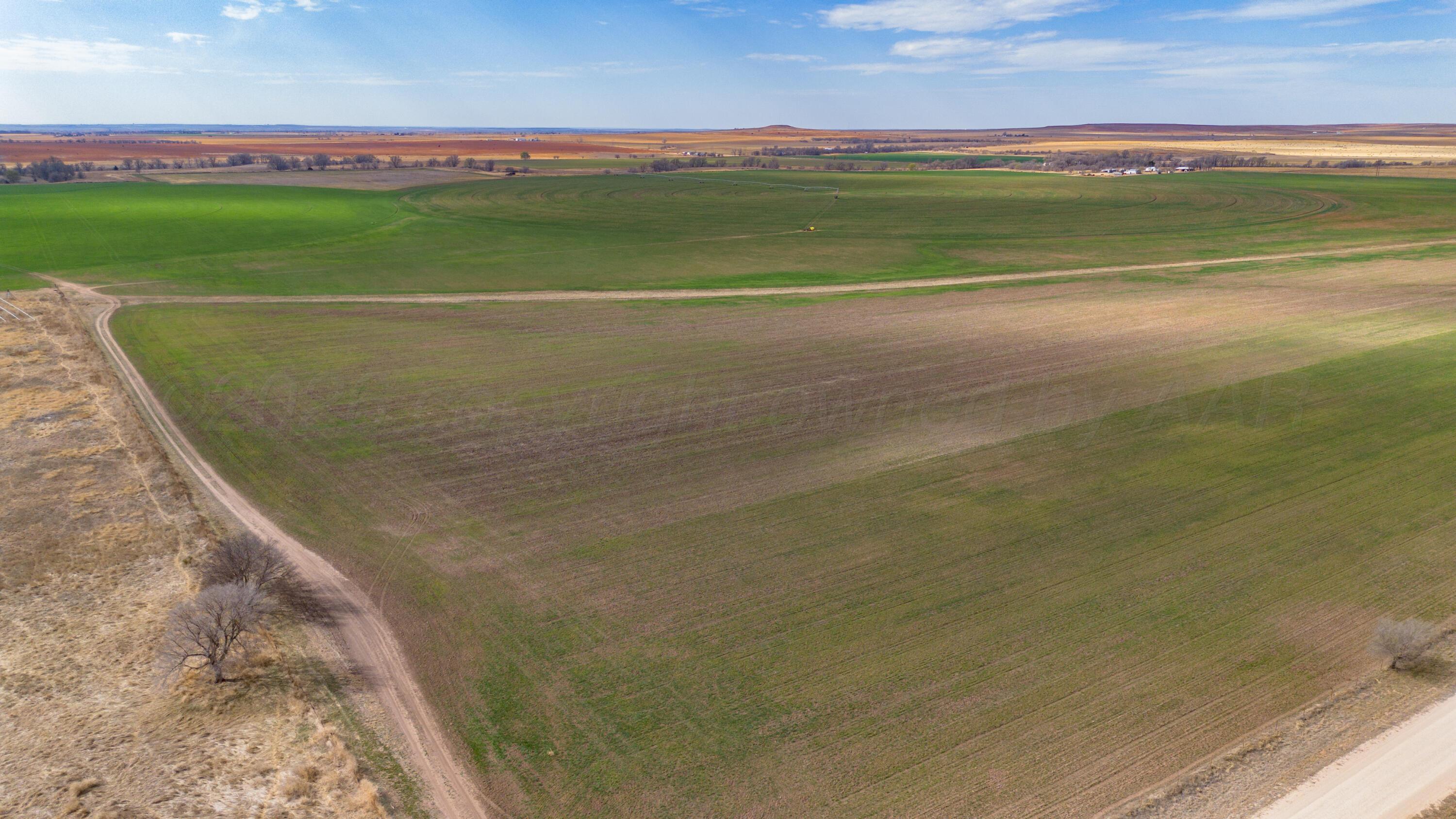 Dodd Farm Mobeetie, TX 79061 - Photo 32 of 46 a view of a lake and a mountain