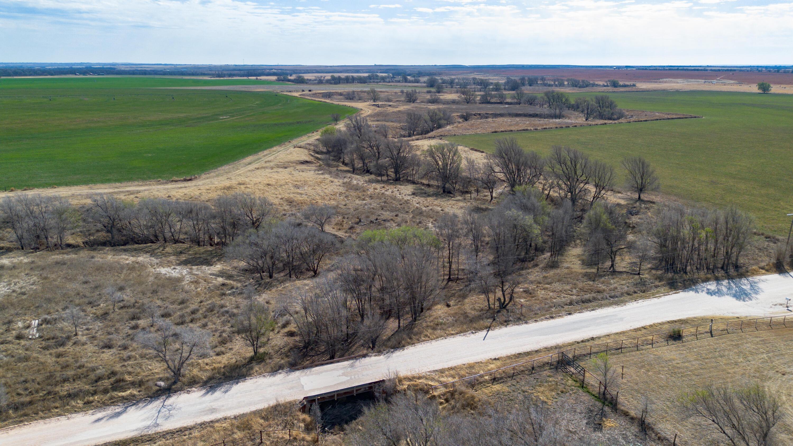 Dodd Farm Mobeetie, TX 79061 - Photo 35 of 46 a view of a lake with a yard