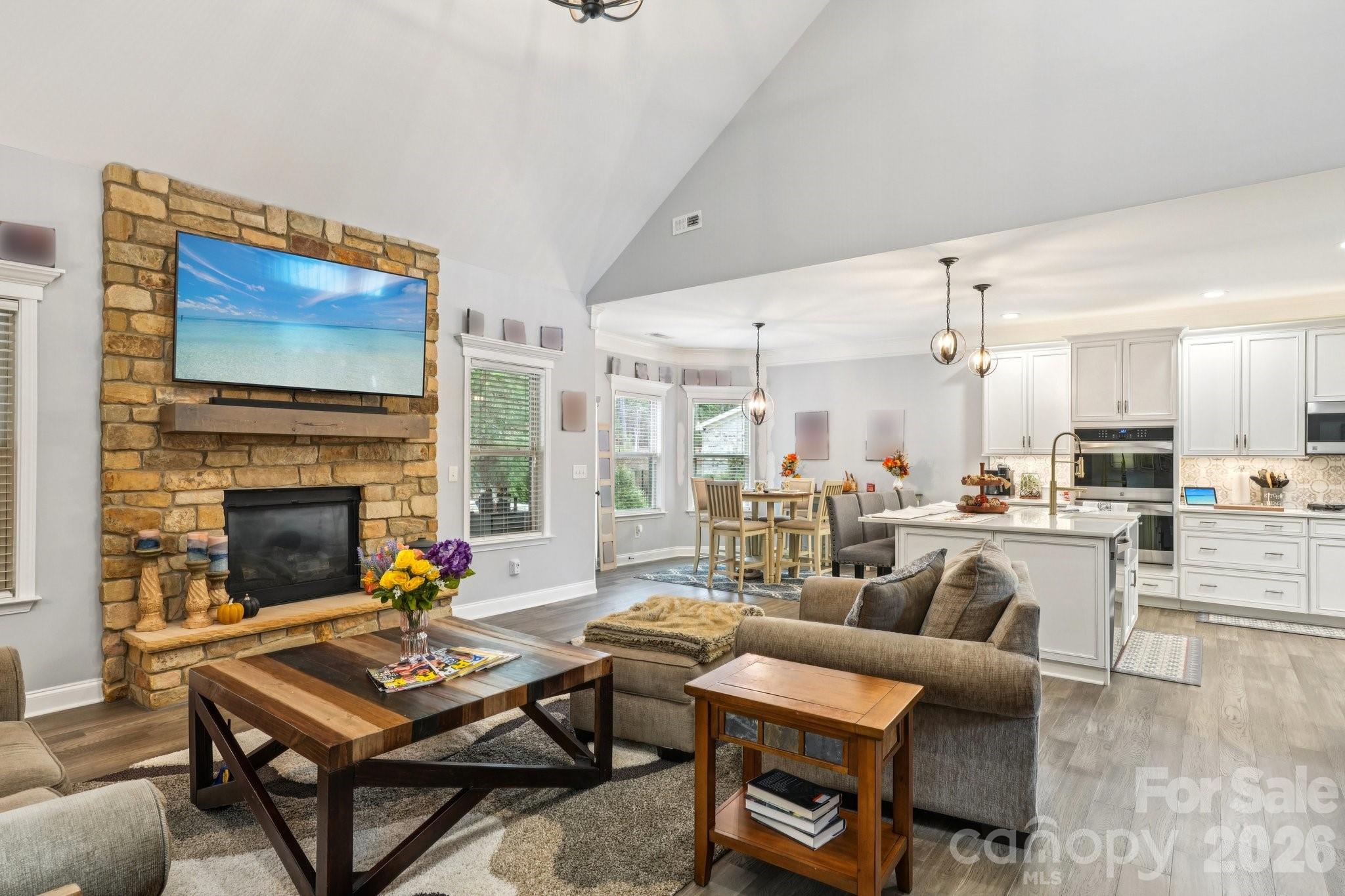 4013 Spindrift Cove Denver, NC 28037 - Photo 11 of 46 a living room with furniture fireplace and a table