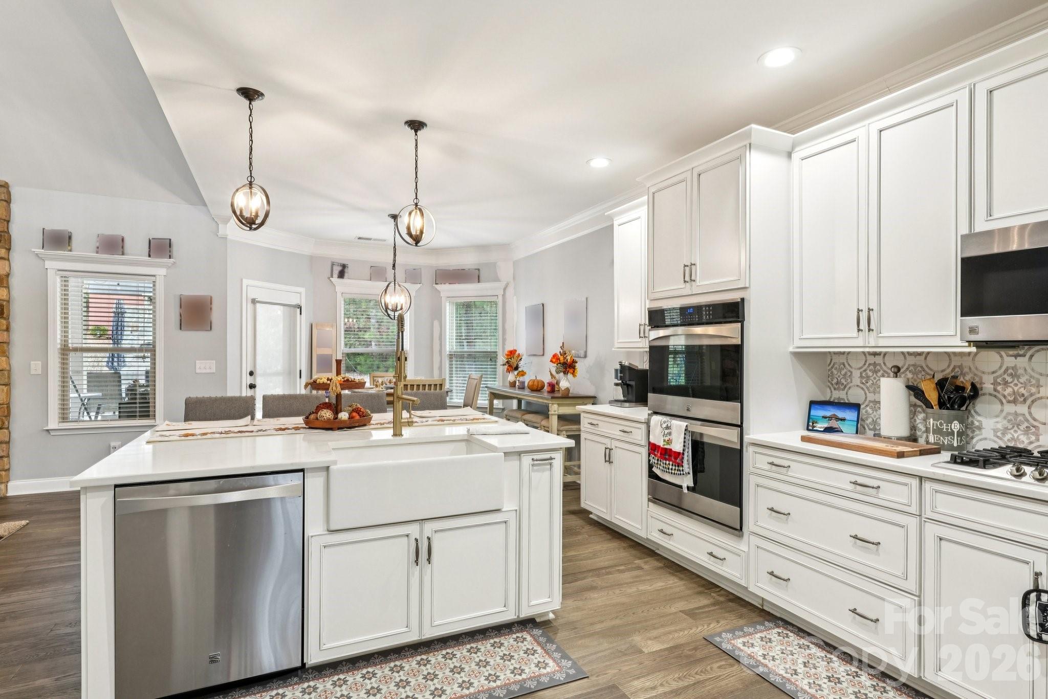4013 Spindrift Cove Denver, NC 28037 - Photo 12 of 46 a kitchen with a sink stove and cabinets
