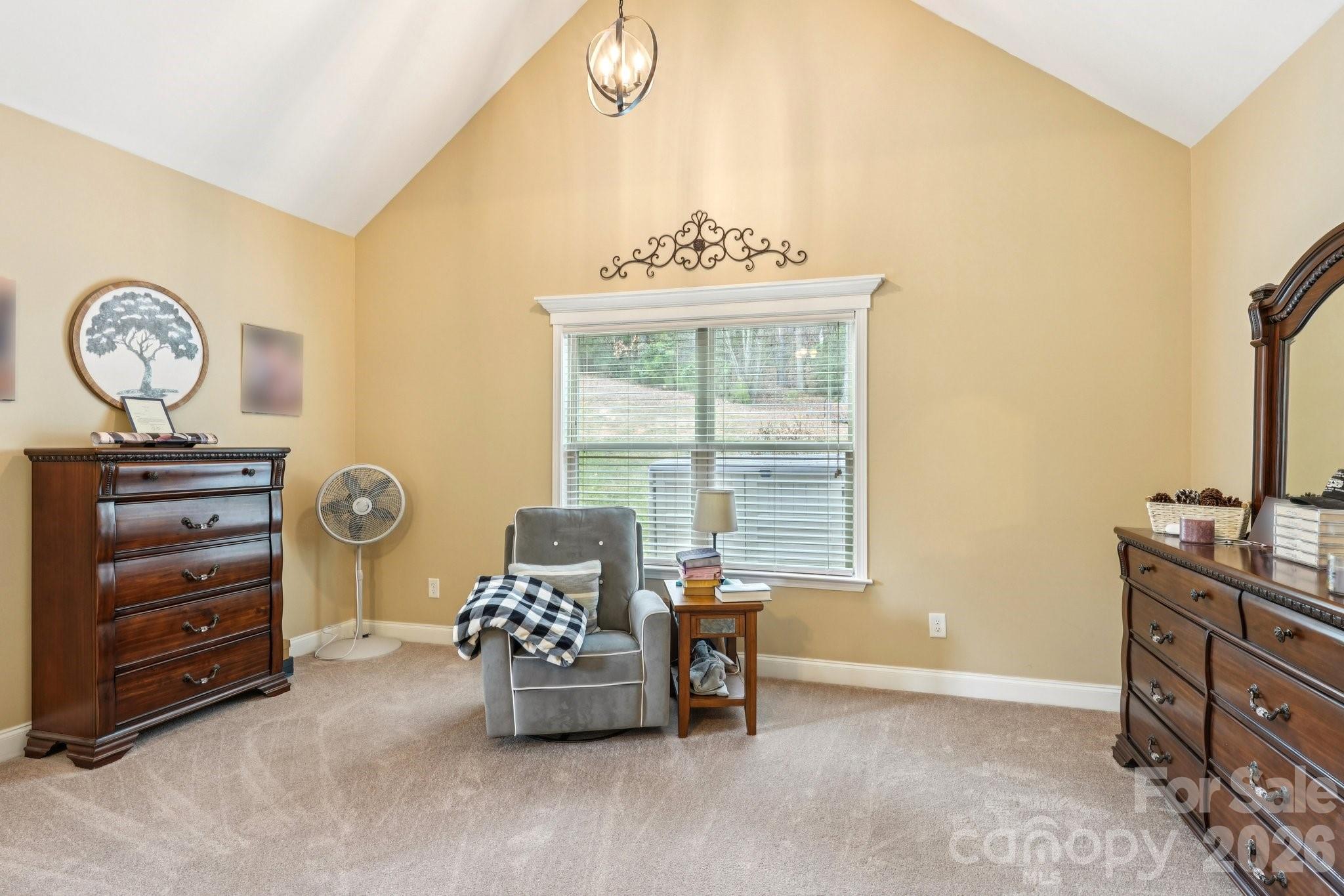 4013 Spindrift Cove Denver, NC 28037 - Photo 18 of 46 a bedroom with a bed and a table