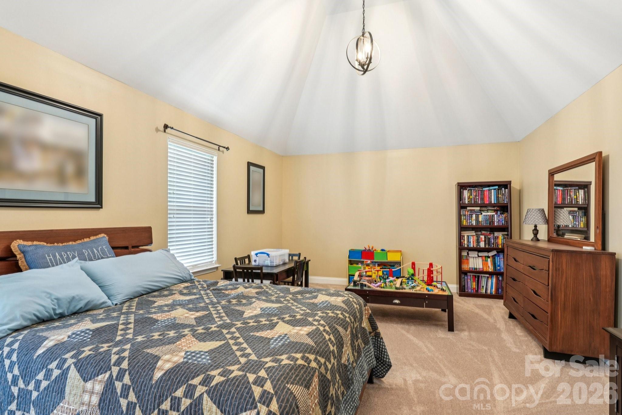 4013 Spindrift Cove Denver, NC 28037 - Photo 22 of 46 a bedroom with a bed and a book shelf