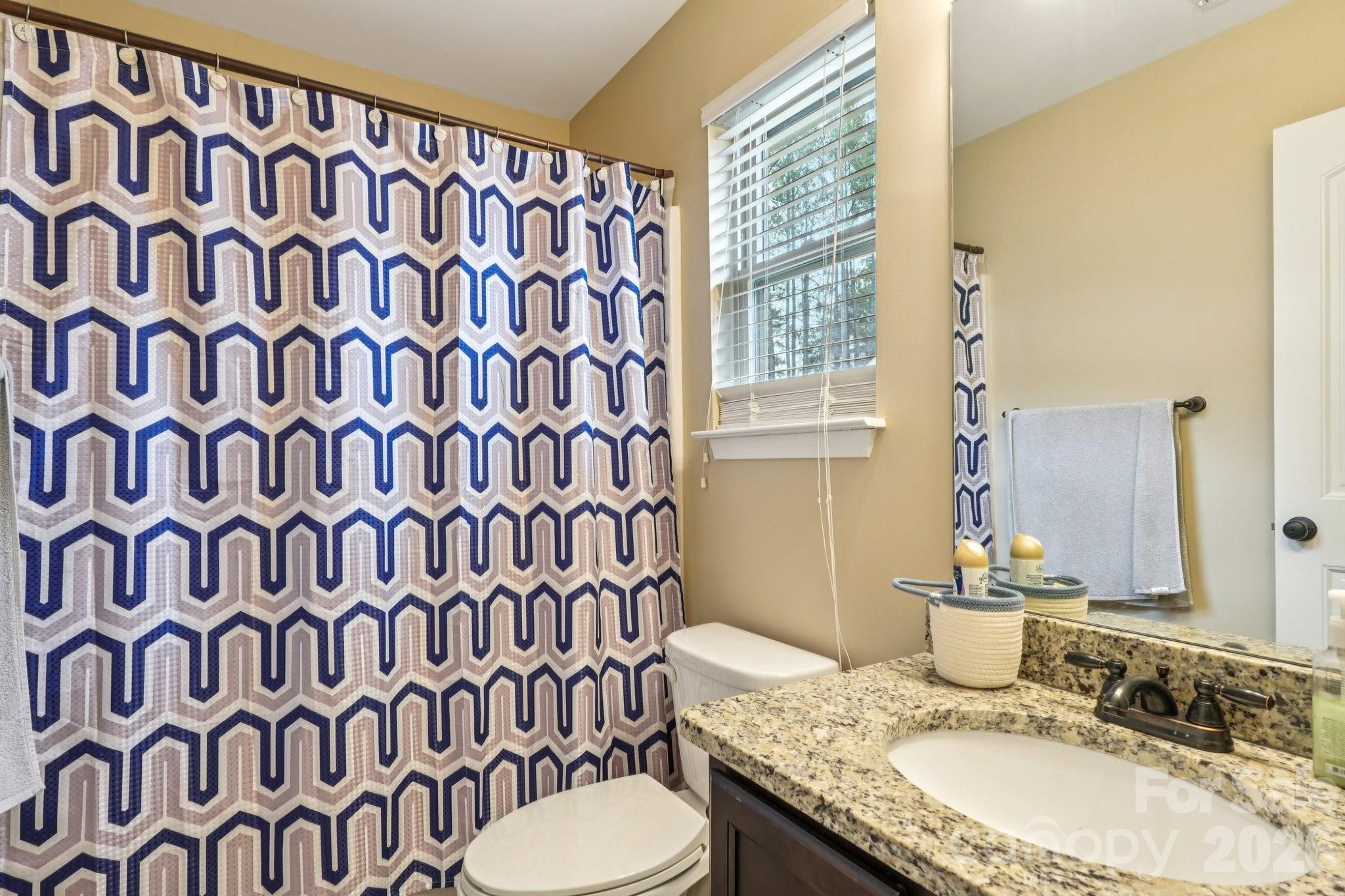 4013 Spindrift Cove Denver, NC 28037 - Photo 24 of 46 a bathroom with a granite countertop sink and a mirror
