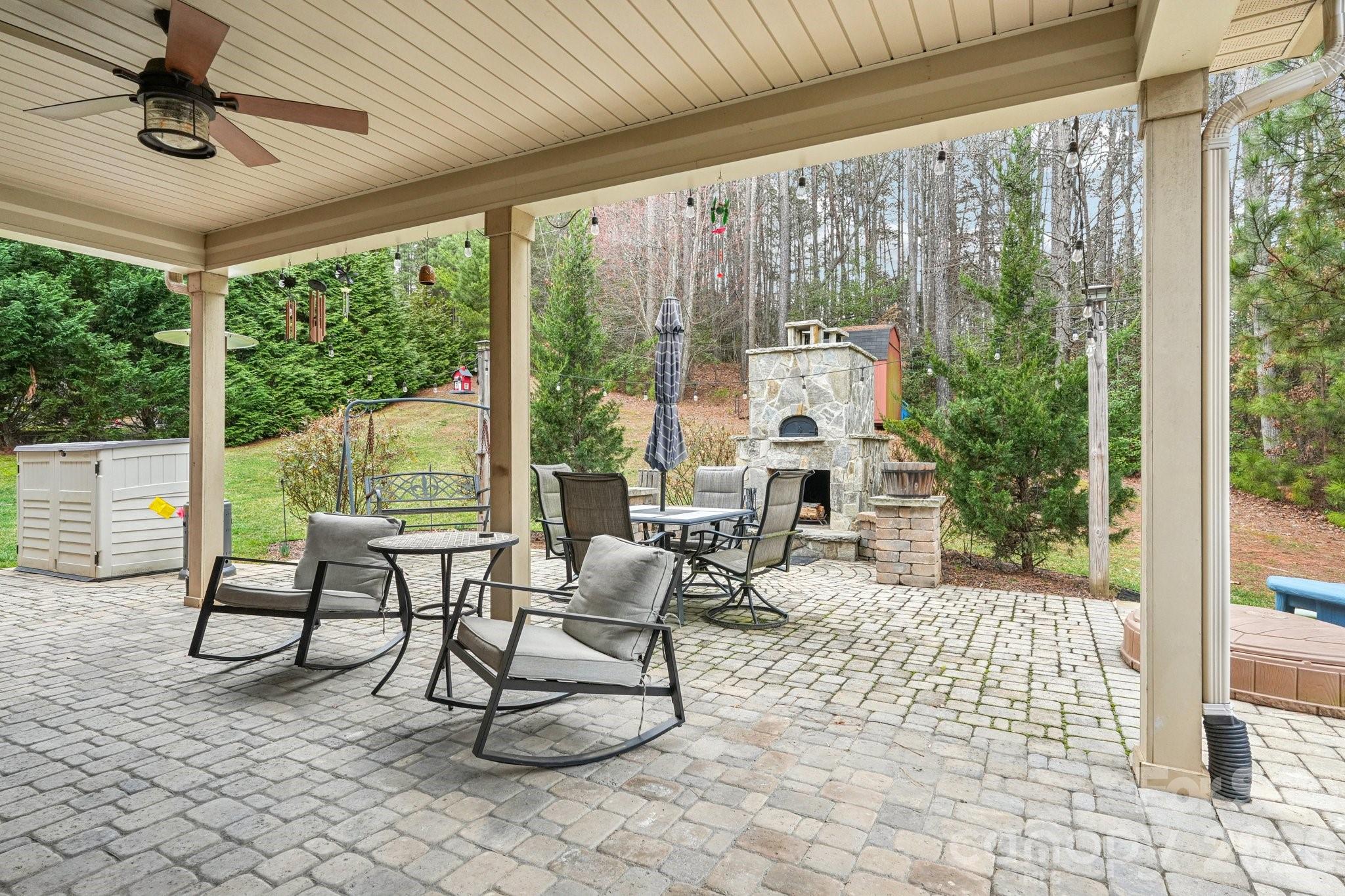 4013 Spindrift Cove Denver, NC 28037 - Photo 30 of 46 a living room with furniture and a floor to ceiling window