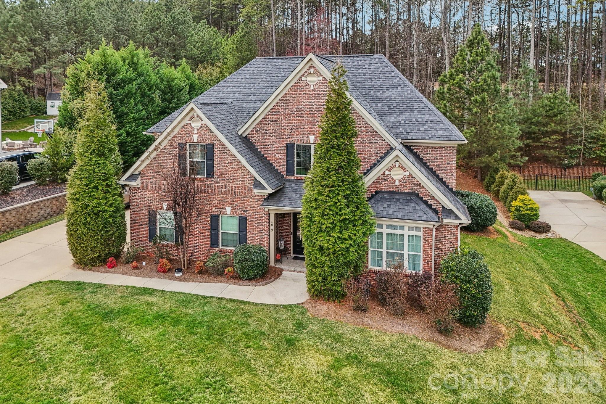 4013 Spindrift Cove Denver, NC 28037 - Photo 44 of 46 a front view of a house with garden