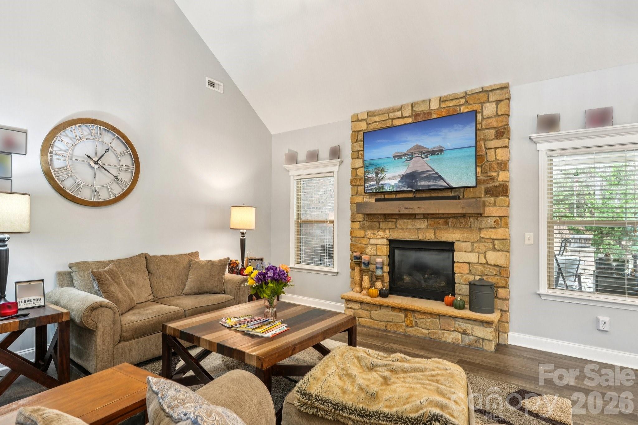 4013 Spindrift Cove Denver, NC 28037 - Photo 10 of 46 a living room with furniture a fireplace and a window