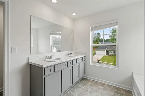 a bathroom with a sink and a window