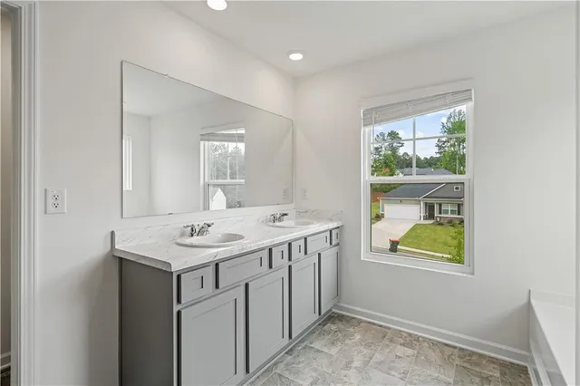 a bathroom with a sink and a window