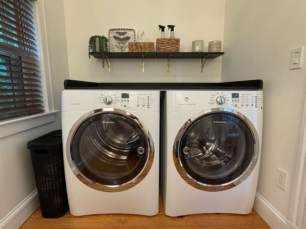 105 Elm Street, Unit A Andover, MA 01810 - Photo 20 of 40 a utility room with dryer and washer