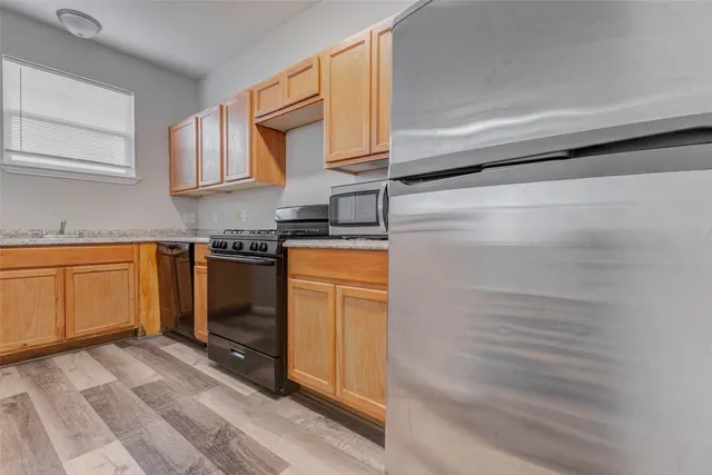 a kitchen with a stove top oven