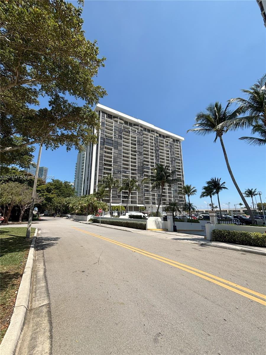 1901 Brickell Avenue, Unit B2310 Miami, FL 33129 - Photo 2 of 16 a front view of a house with a yard