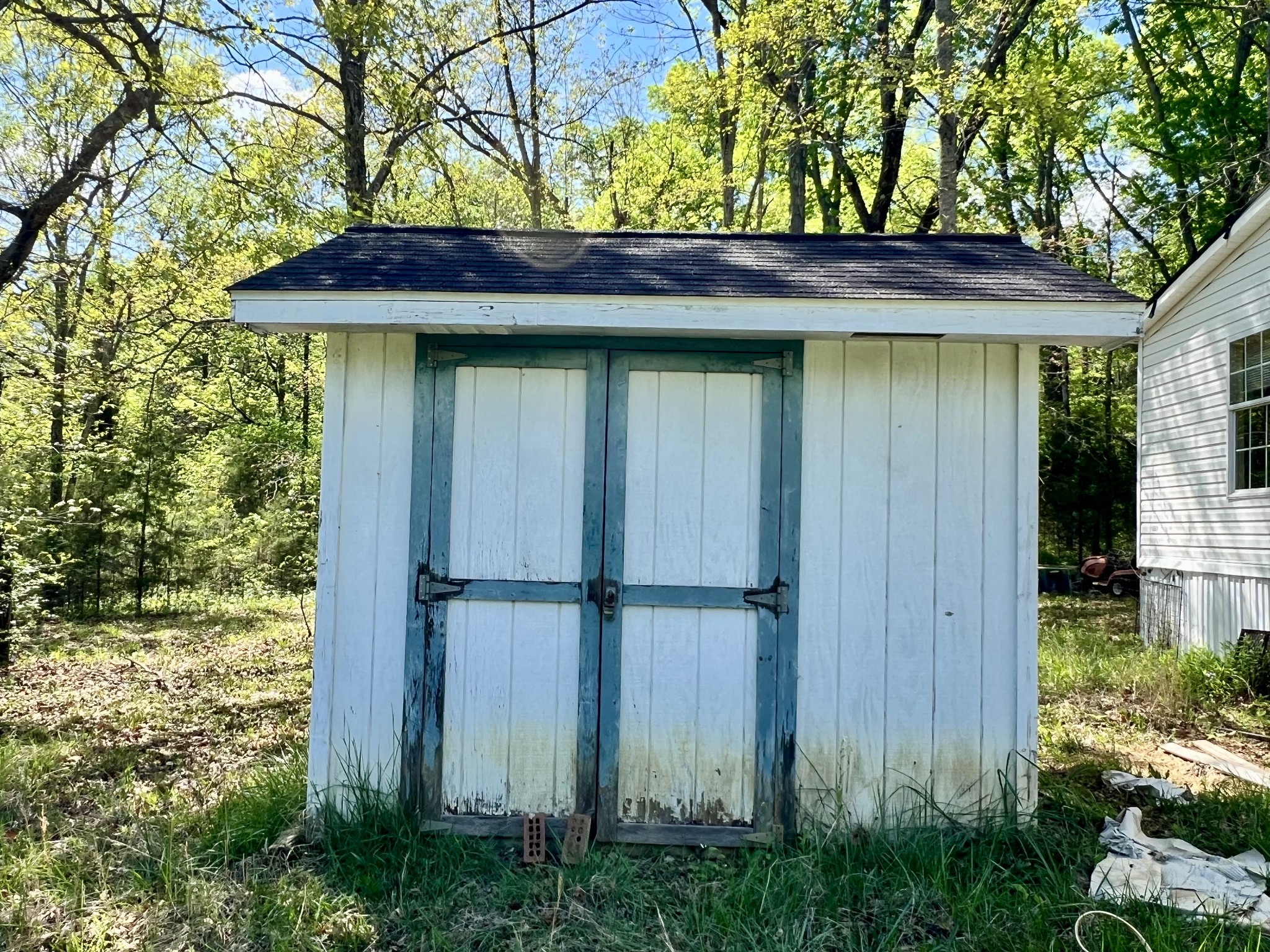 4552 Kedron Road Spring Hill, TN 37174 - Photo 10 of 21 a couple of potted plants in front of door with wooden fence