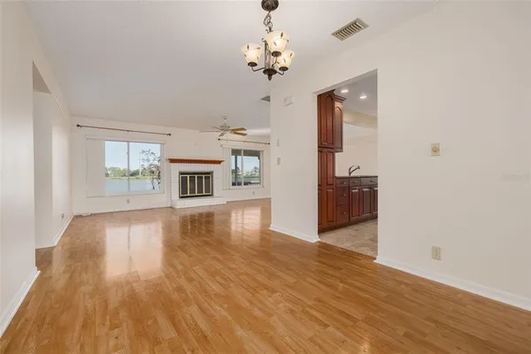 a kitchen with stainless steel appliances granite countertop a refrigerator stove and sink