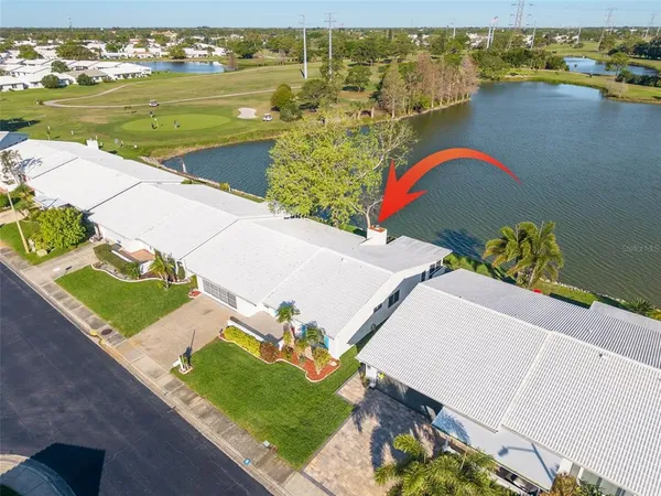 an aerial view of a house with a lake view