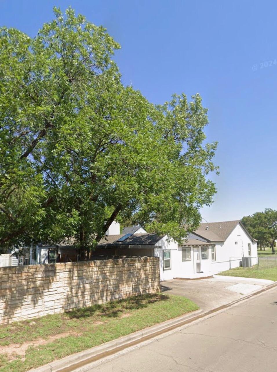 2301 27th Street Lubbock, TX 79411 - Photo 19 of 22 a view of a house with a yard and balcony
