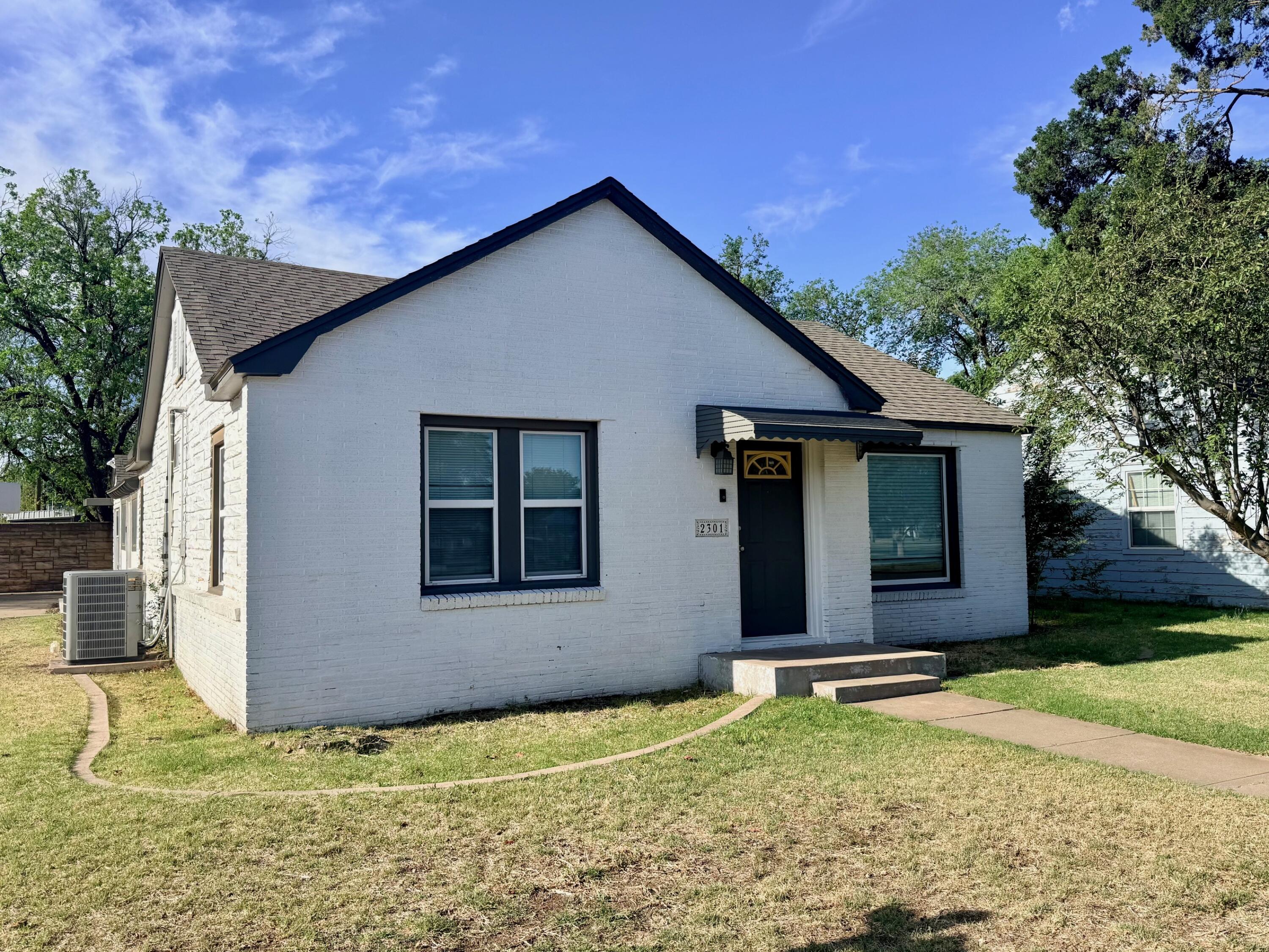 2301 27th Street Lubbock, TX 79411 - Photo 20 of 22 a house with yard in front of it