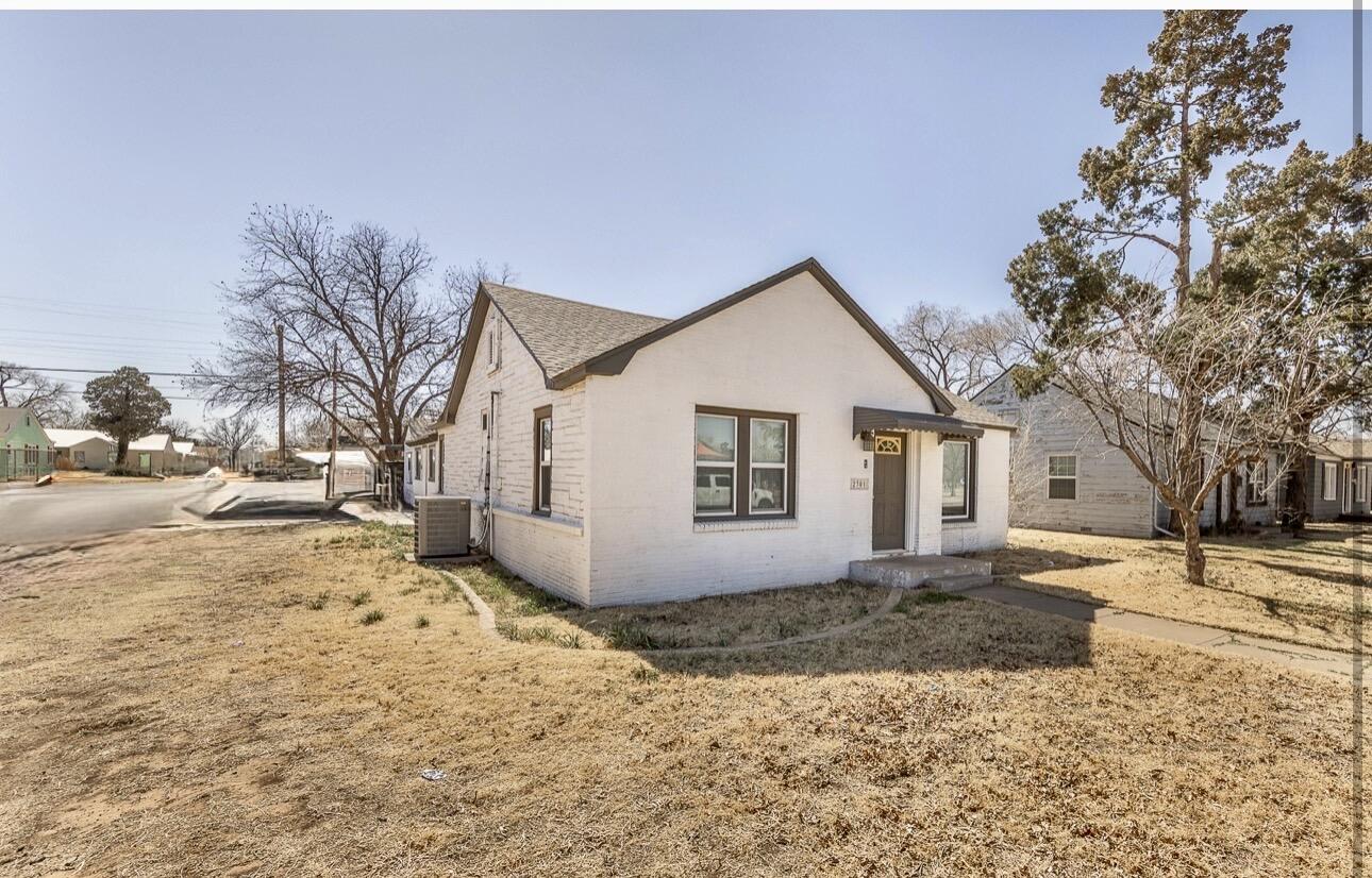 2301 27th Street Lubbock, TX 79411 - Photo 2 of 22 a view of a house with a yard covered in snow