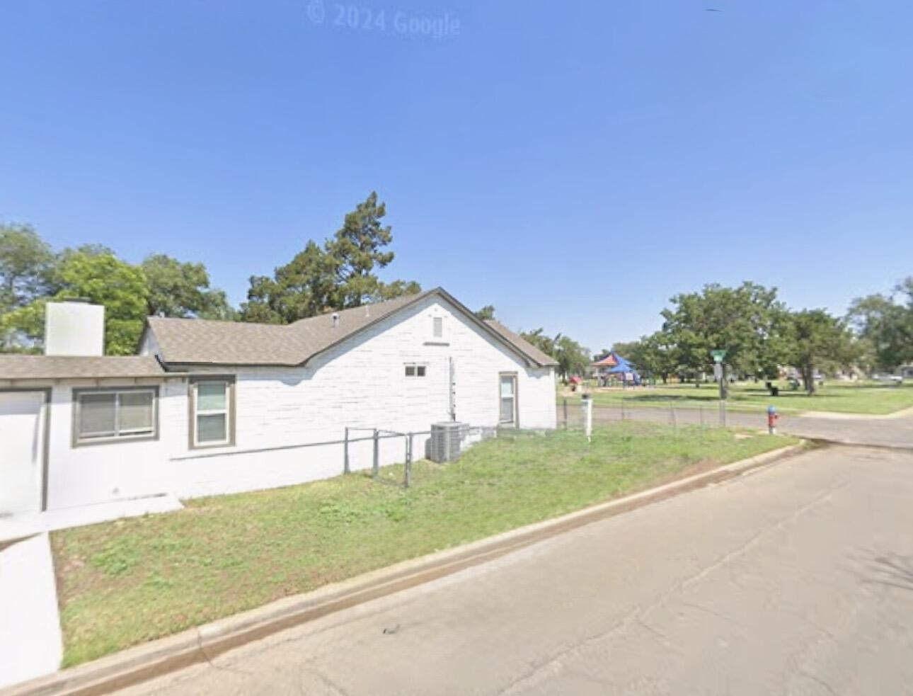 2301 27th Street Lubbock, TX 79411 - Photo 21 of 22 a view of a house with a big yard and potted plants