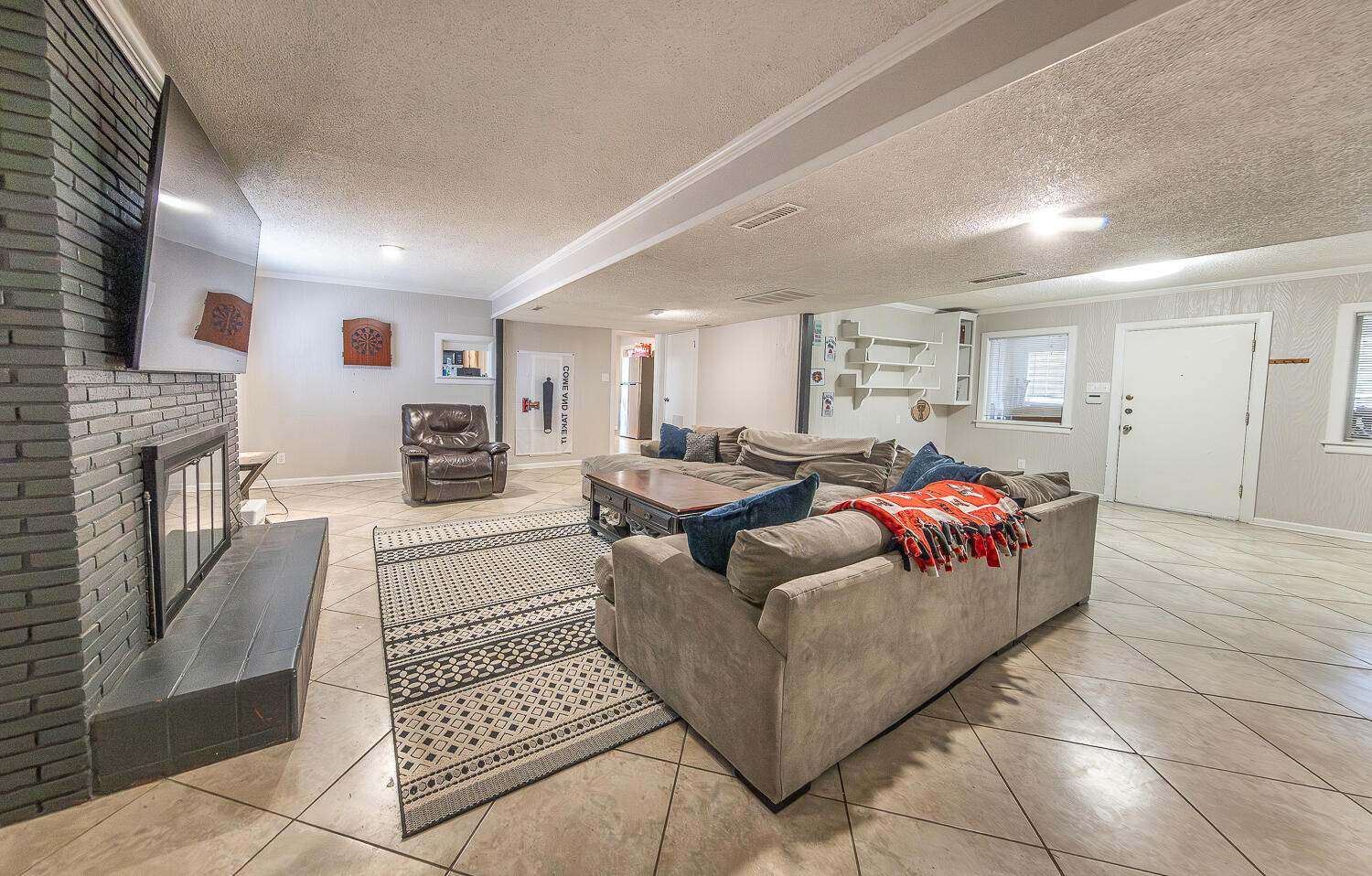 2301 27th Street Lubbock, TX 79411 - Photo 4 of 22 a living room with furniture and a fireplace