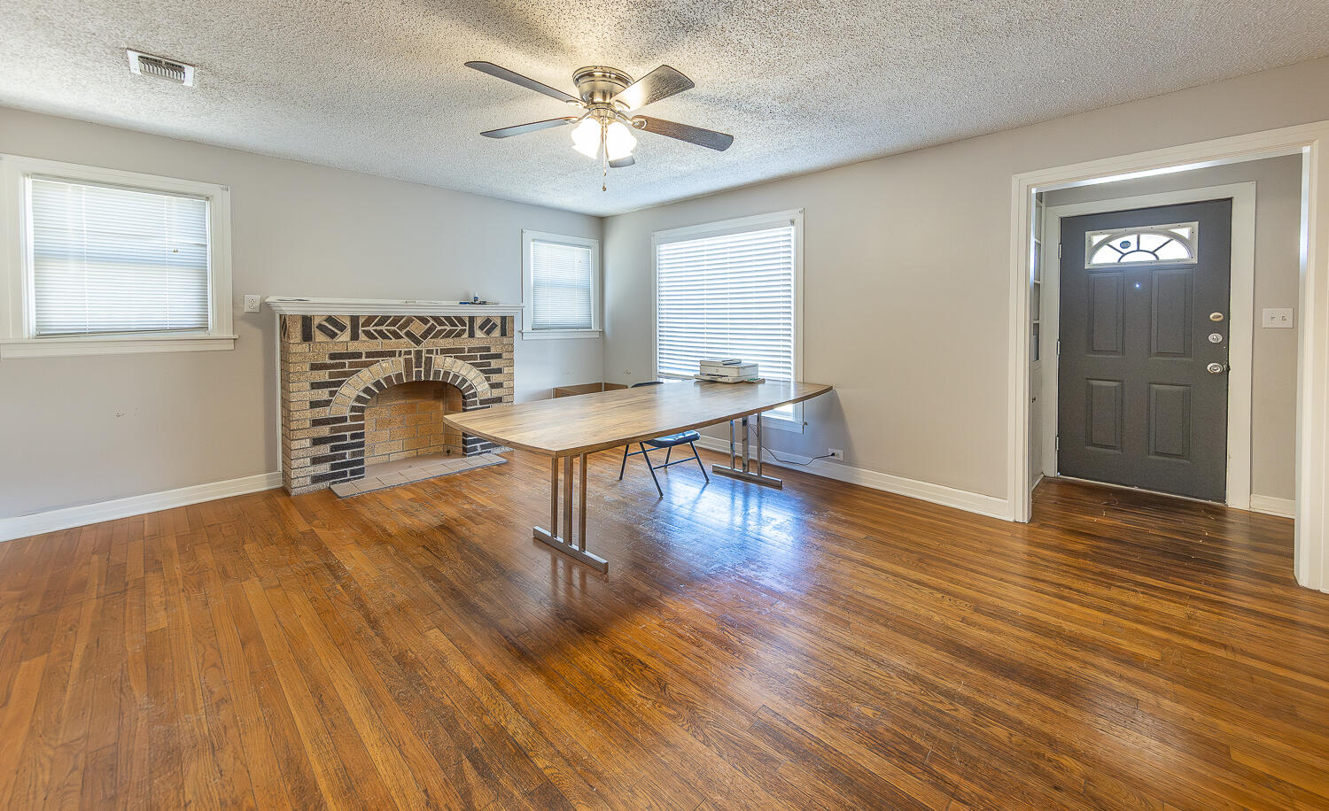 2301 27th Street Lubbock, TX 79411 - Photo 10 of 22 a view of livingroom with furniture wooden floor and a ceiling fan