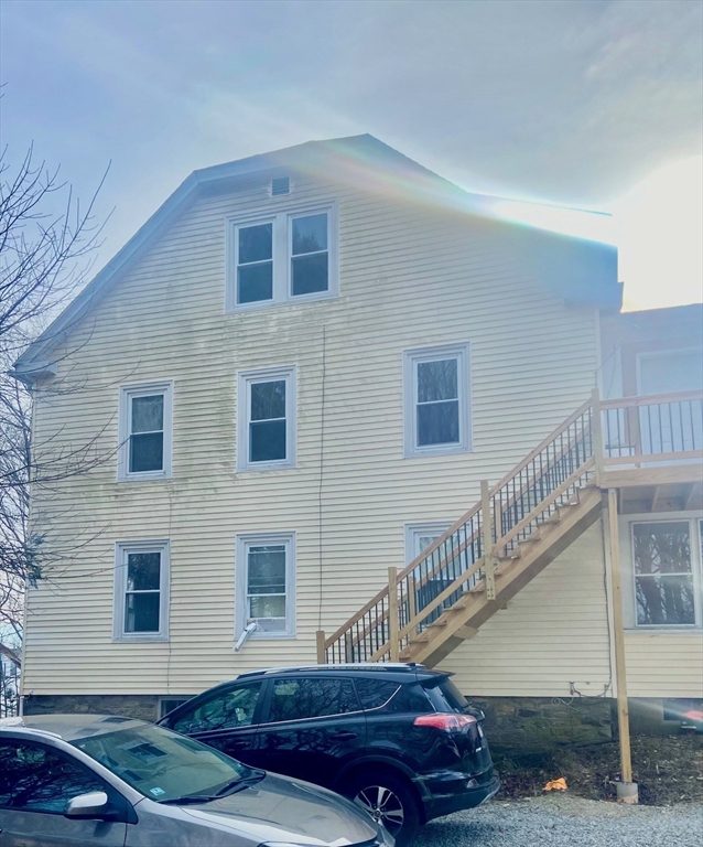 7 3rd Avenue Dudley, MA 01571 - Photo 15 of 19 a front view of a house with a yard
