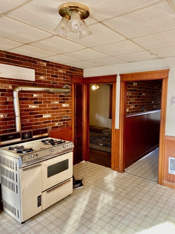7 3rd Avenue Dudley, MA 01571 - Photo 6 of 19 a kitchen with stainless steel appliances granite countertop a stove and a refrigerator