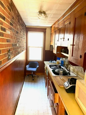 a kitchen with a stove and a refrigerator