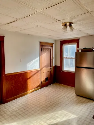 a kitchen with a refrigerator a stove top oven a sink and a refrigerator