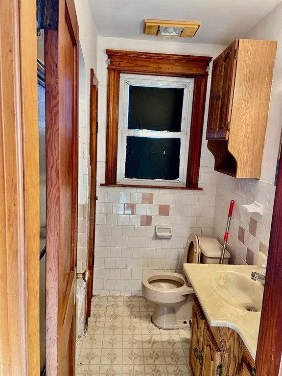 7 3rd Avenue Dudley, MA 01571 - Photo 9 of 19 a bathroom with a toilet sink and mirror