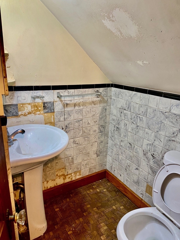 7 3rd Avenue Dudley, MA 01571 - Photo 10 of 19 a bathroom with a sink a toilet and a mirror