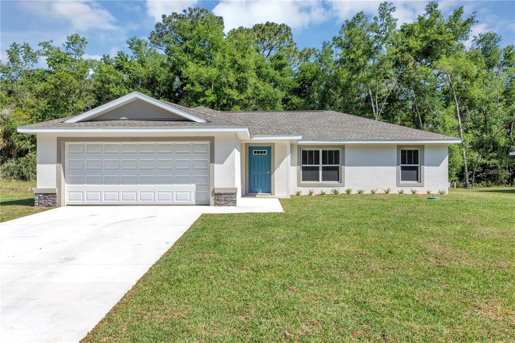 273 Locust Pass Ocala, FL 34472 - Photo 1 of 1 front view of a house with a yard