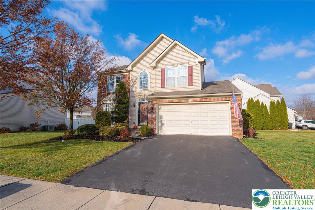 1120 Tyler Way Bethlehem, PA 18017 - Photo 2 of 67 a front view of a house with a yard and garage