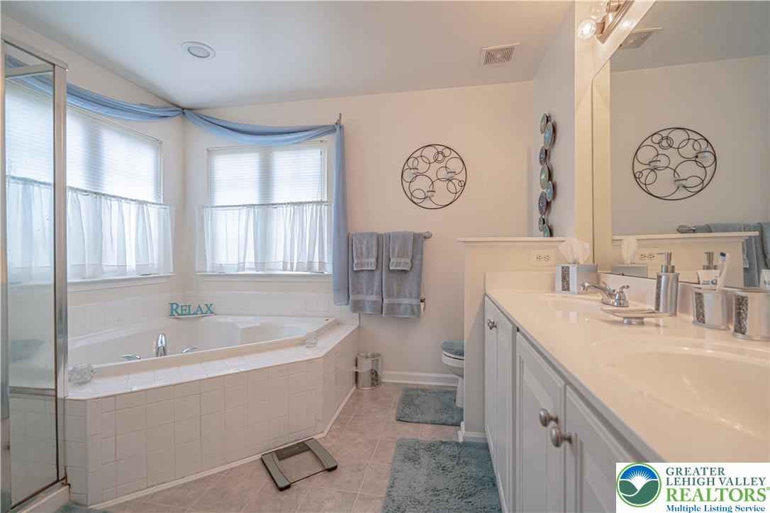 1120 Tyler Way Bethlehem, PA 18017 - Photo 31 of 67 a spacious bathroom with a tub sink and mirror