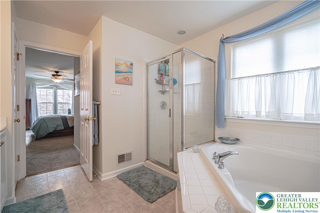 1120 Tyler Way Bethlehem, PA 18017 - Photo 32 of 67 a bathroom with a tub a sink and a shower
