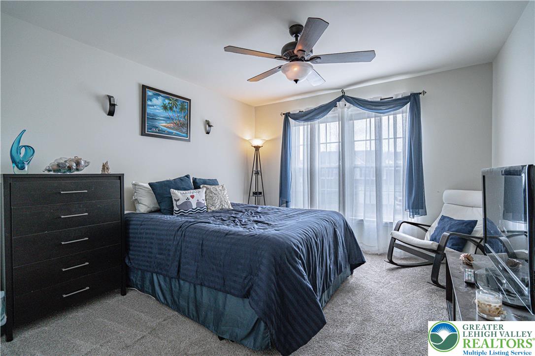 1120 Tyler Way Bethlehem, PA 18017 - Photo 40 of 67 a bedroom with a bed and a chandelier