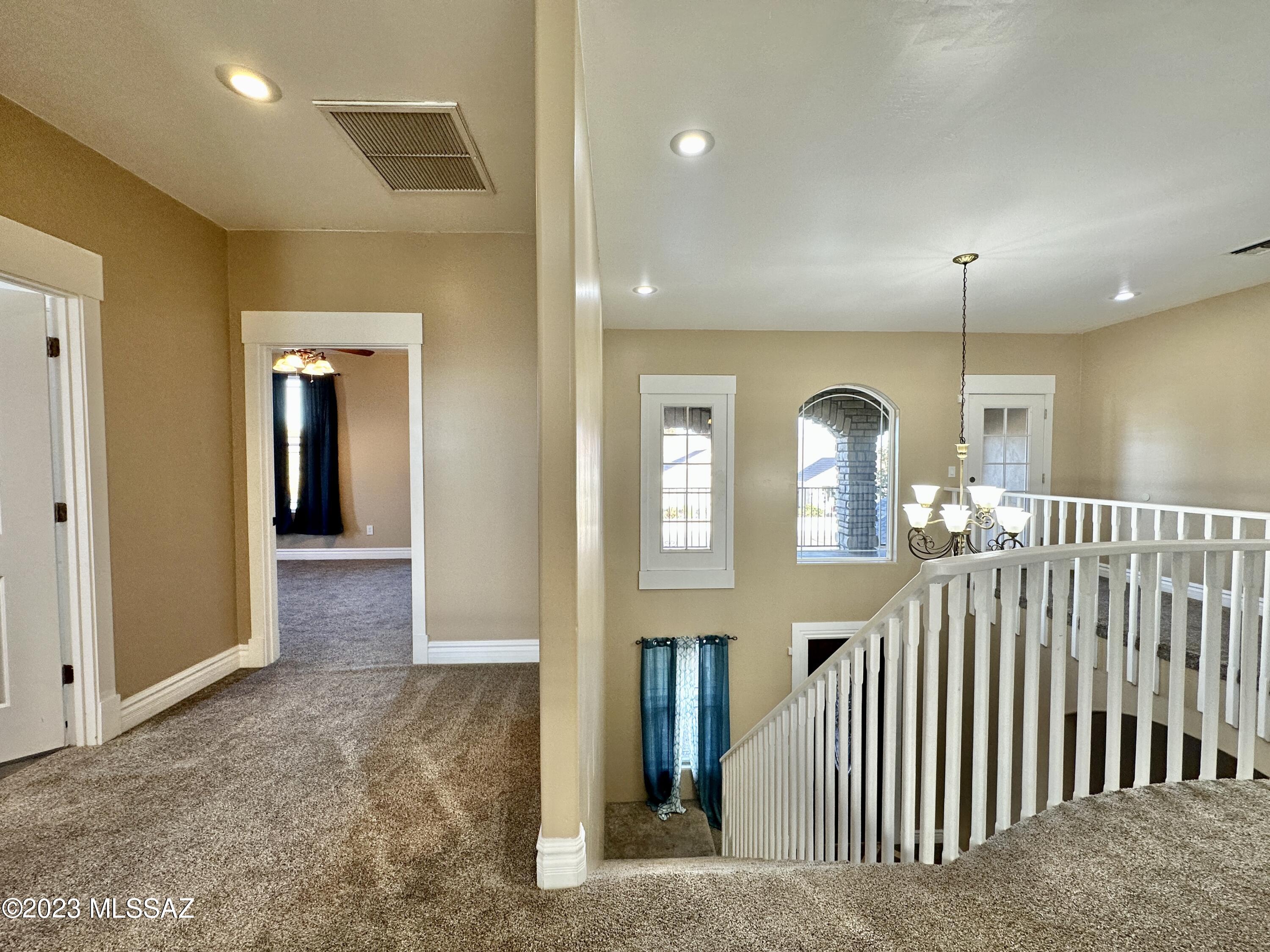 508 Eagle Meadow Loop Thatcher, AZ 85552 - Photo 19 of 32 a view of a hallway with entryway window and stairs