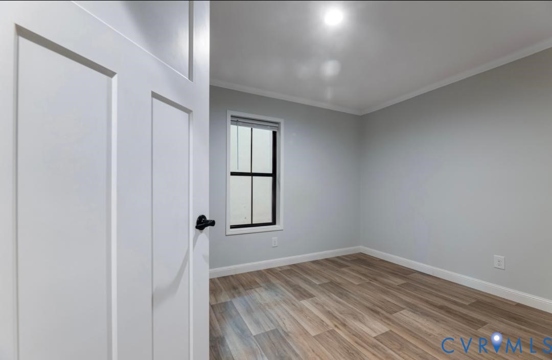 Lot 35 Mt Nebo Road Barhamsville, VA 23011 - Photo 13 of 13 Empty room with light wood-style flooring and orna