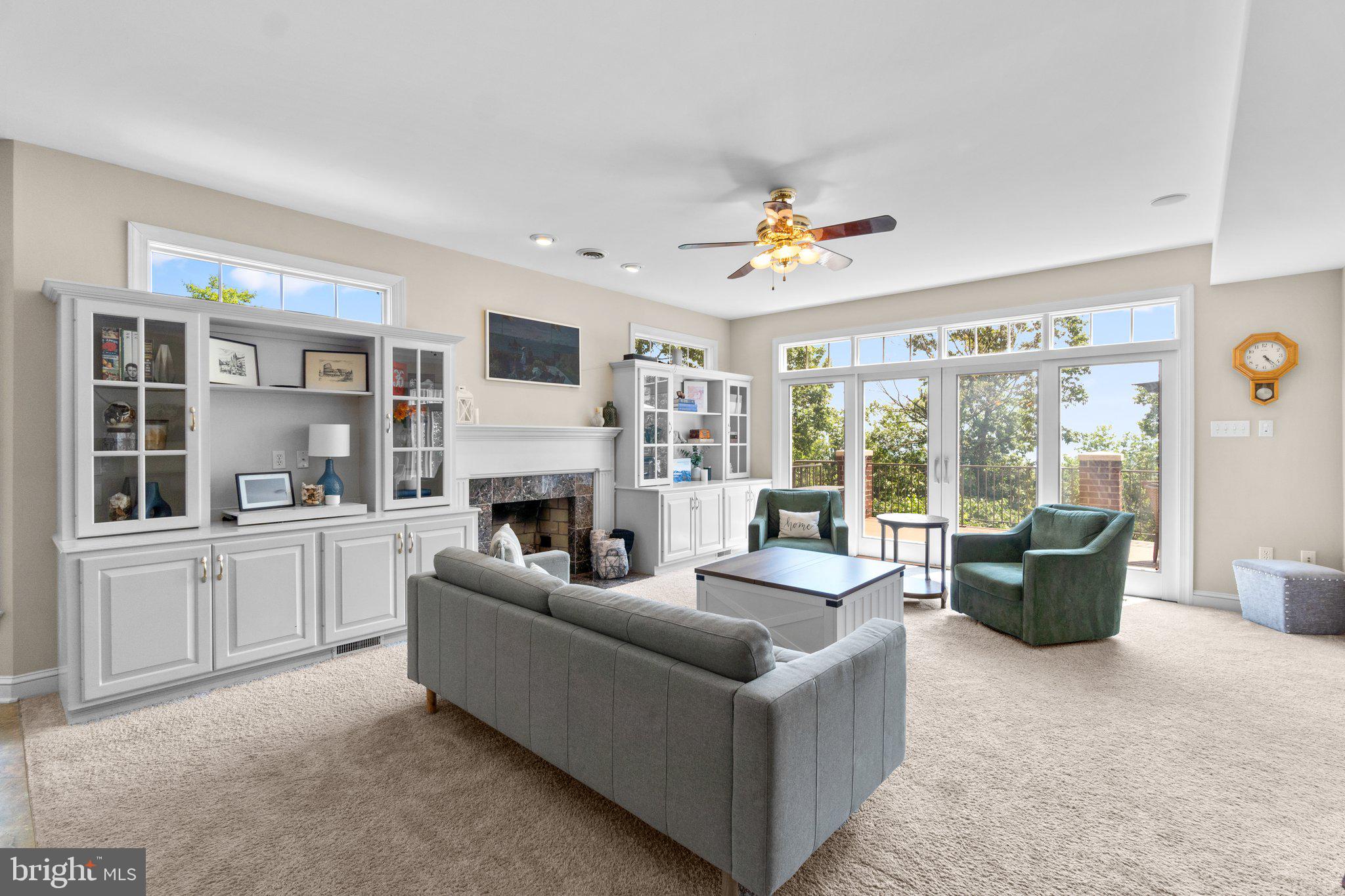 7341 Kehne Road Frederick, MD 21702 - Photo 12 of 67 a living room with furniture a fireplace and a flat screen tv
