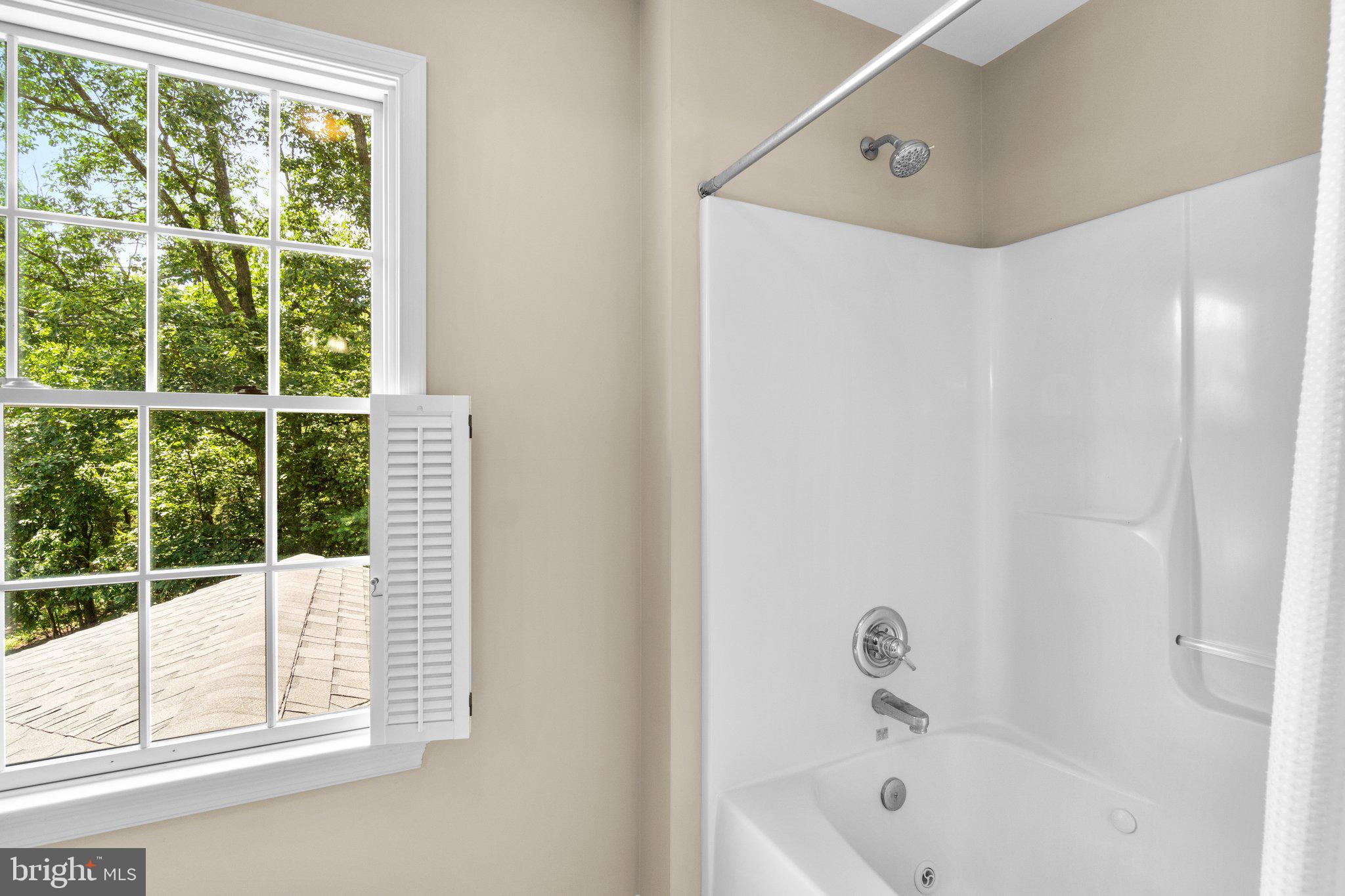 7341 Kehne Road Frederick, MD 21702 - Photo 24 of 67 a bathroom with a bathtub and a shower