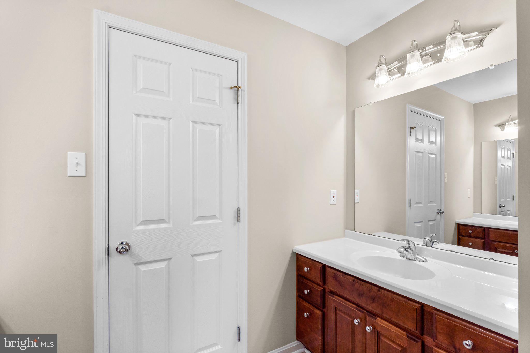 7341 Kehne Road Frederick, MD 21702 - Photo 33 of 67 a bathroom with a sink and a mirror