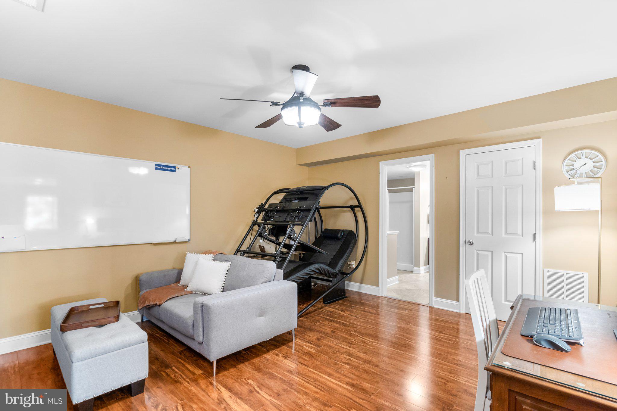 7341 Kehne Road Frederick, MD 21702 - Photo 44 of 67 a living room with furniture and a chandelier